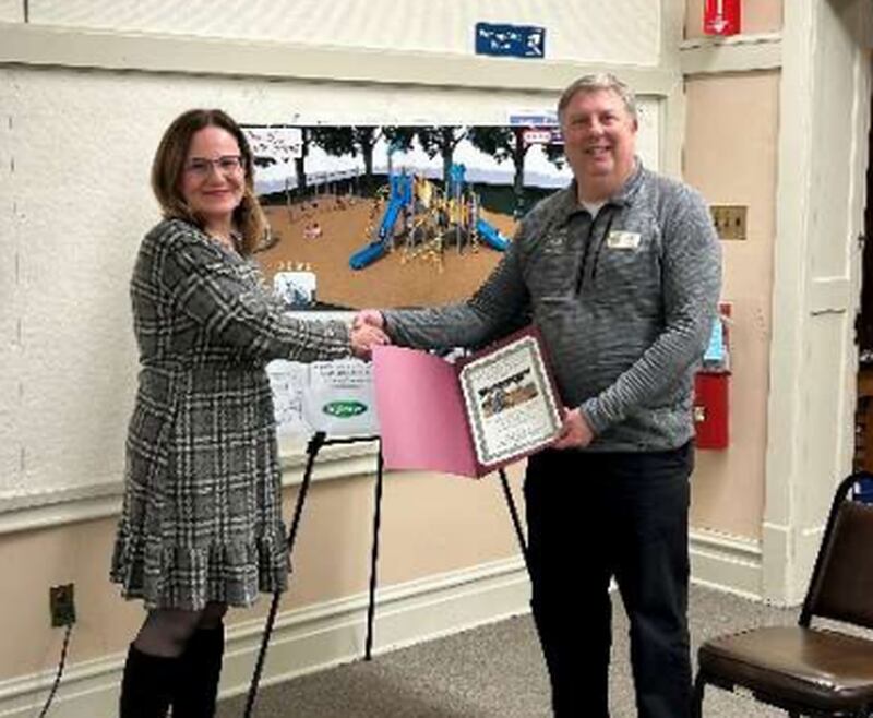 (From left) Maple Park Village President Suzanne Fahnestock presents a certificate of appreciation to Daniel Templin, executive director of the DeKalb County Community Foundation on Tuesday. Dec. 3, 2024, at the Maple Park Village Board meeting.