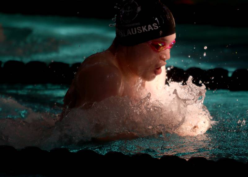 Ignas Venslauskas of Cary-Grove co-op swims the 100-Yard Breaststroke during the Fox Valley Conference Swimming Championships at Woodstock North High School Saturday.
