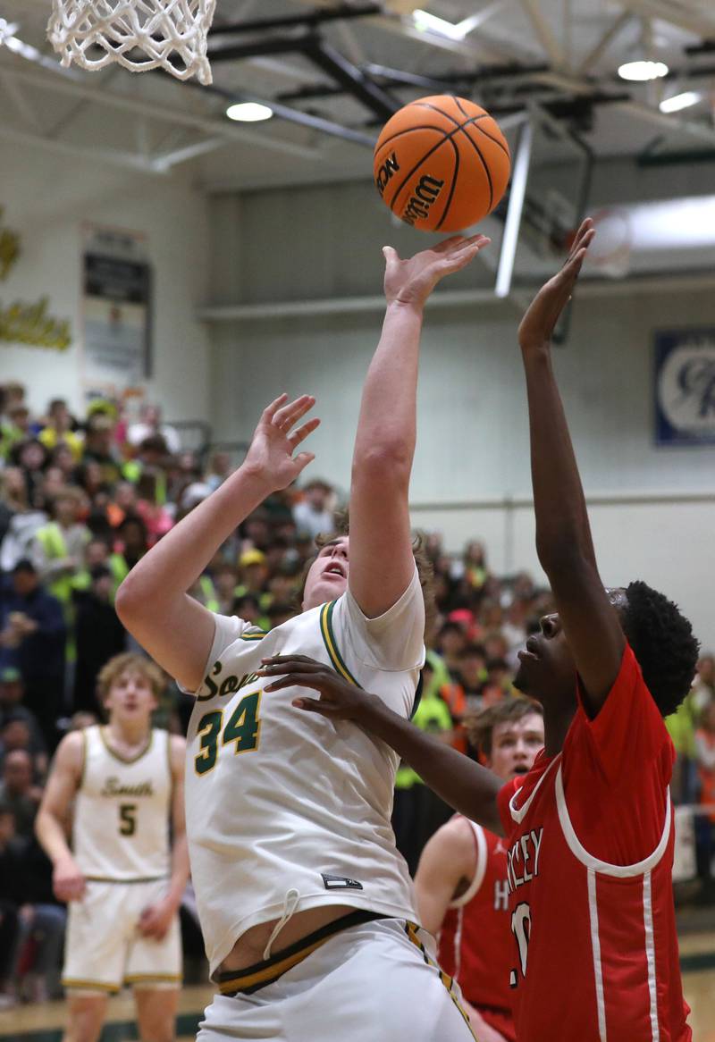 Crystal Lake South's Johnathan Morgan shoots the ball in front of Huntley's Isaiah Onu during a Fox Valley Conference boys basketball game on Friday, Jan. 30, 2026, at Crystal Lake South High School.