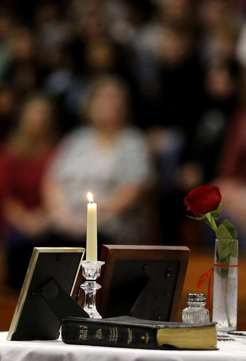 A candle burns on the POW/MIA Remembrance Table during the Veterans Day ceremony Wednesday, Nov.8, 2023, at Alden-Hebron High School in Hebron.