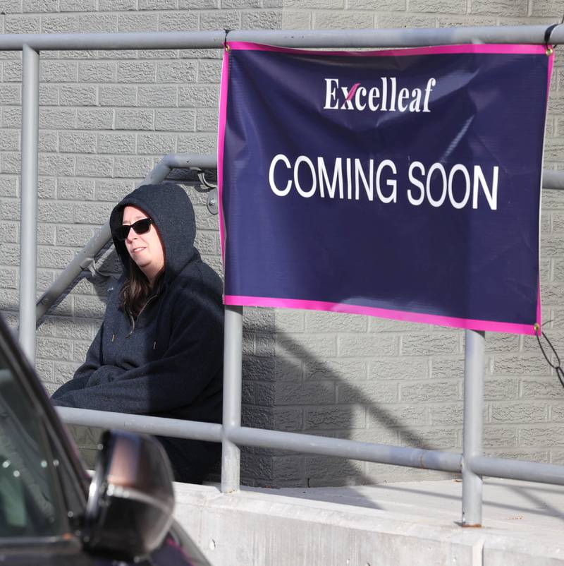 Jessica Beatrice, of DeKalb, is the first person waiting Friday, Nov. 24, 2023, for the soft opening of Excelleaf in DeKalb. The business is DeKalb County’s first recreational marijuana dispensary.