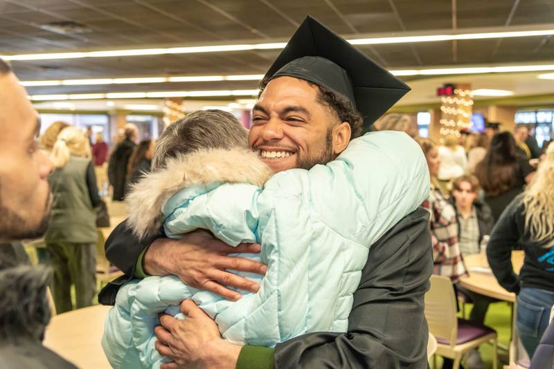 A student celebrates after McHenry County College's winter commencement ceremony on Saturday, Dec. 10, 2022.
