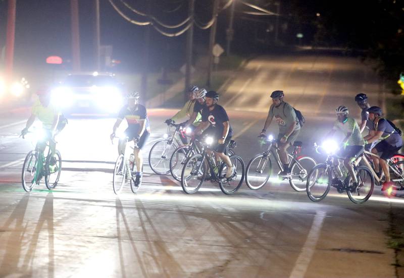 Participants begin the Raue Center for the Arts Night Owl Bike Ride in Crystal Lake on Saturday, August 2, 2025.