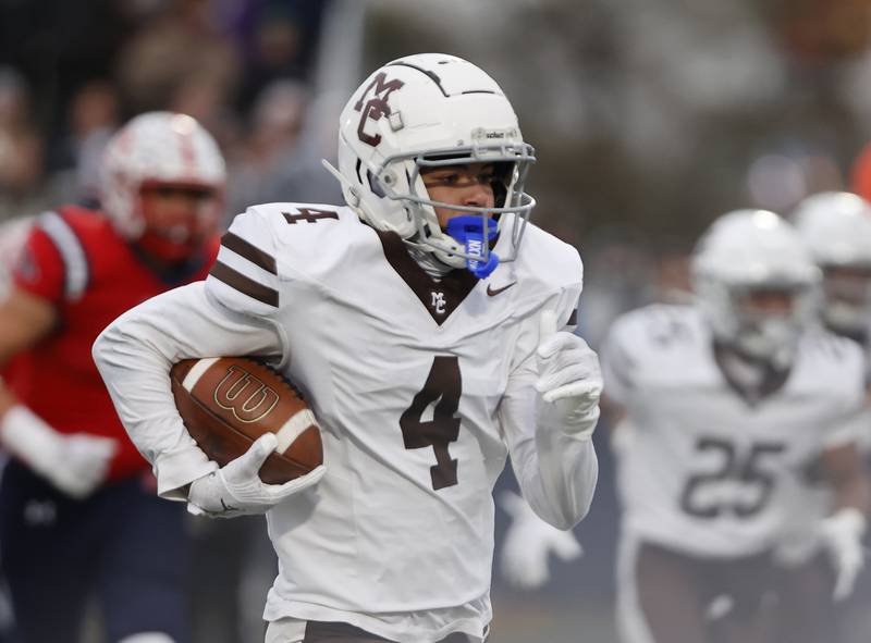 Mt. Carmel's Quentin Burell (4) runs for a touchdown during the class 7A semi-final playoff game between Mt. Carmel and St. Rita high schools on Saturday, Nov. 23, 2024 in Chicago.