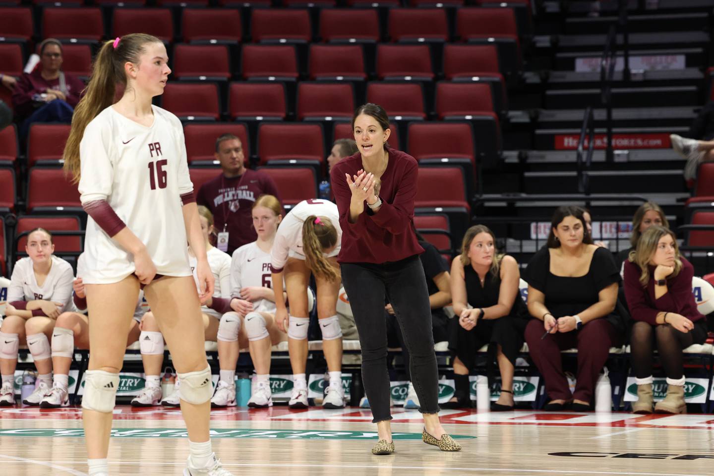 Prairie Ridge head coach Leah Groat encourages her team during the Wolves' loss in two sets, 25-20, 25-28, in the IHSA Class 3A State semifinals on Friday, Nov. 14, 2025.