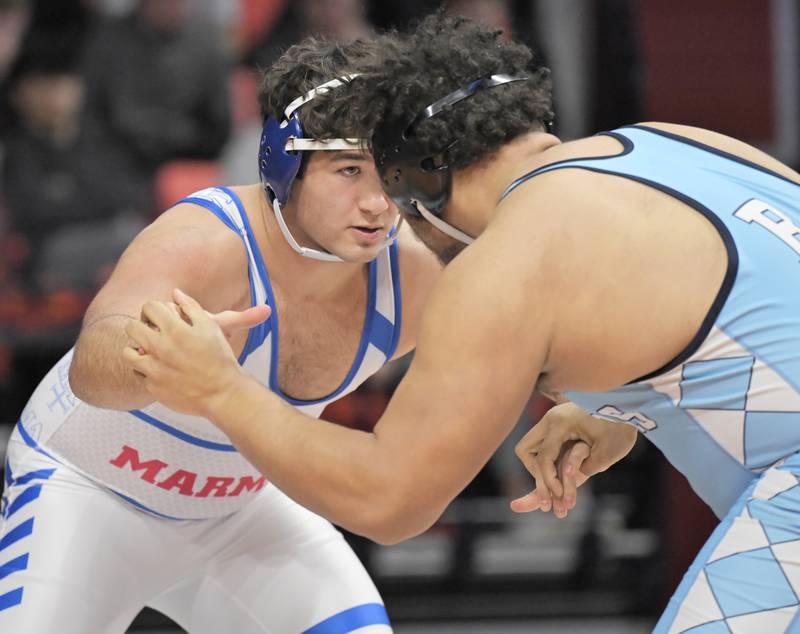 Marmion’s Joseph Fauia works against Belleville’s Jonathan Rulo in the Class 3A 285-pound bout at the boys IHSA wrestling finals at State Farm Center in Champaign on Saturday, Feb. 21, 2026.