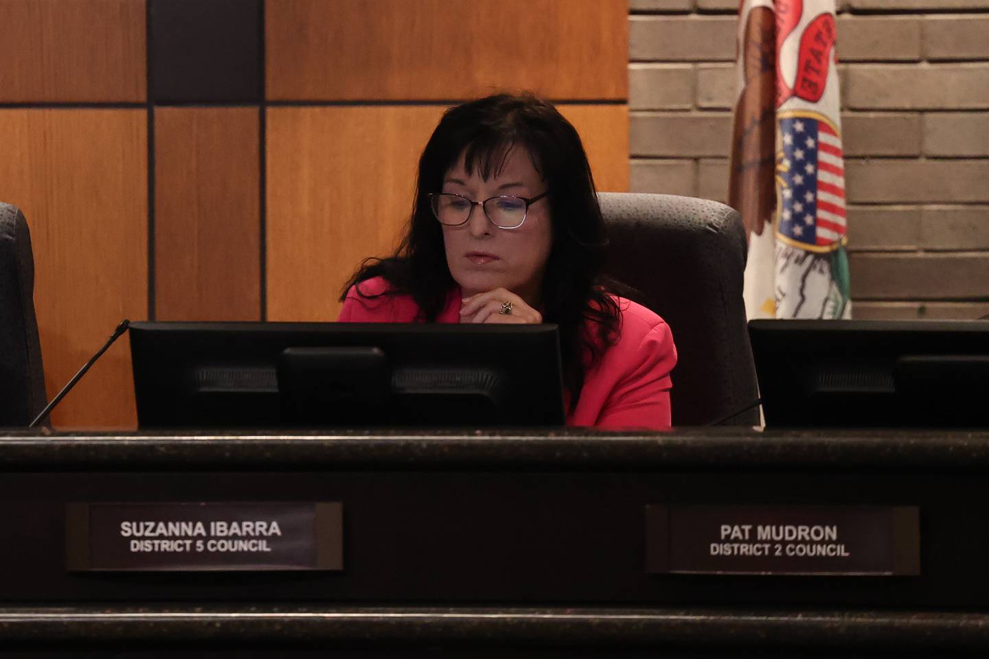 Joliet City Council member Suzanna Ibarra looks over a slide at the Joliet City Council meeting on Tuesday, July 18th, 2023.