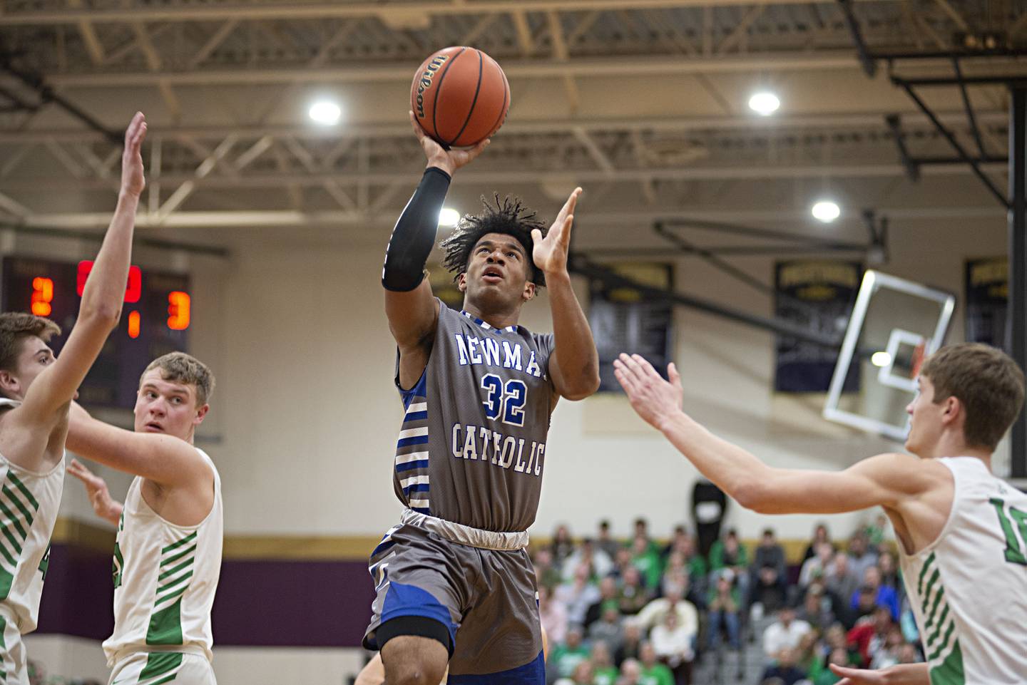 Newman's Marcus Williams puts up a shot against Scales Mound in the sectional final Friday, March 4, 2022.