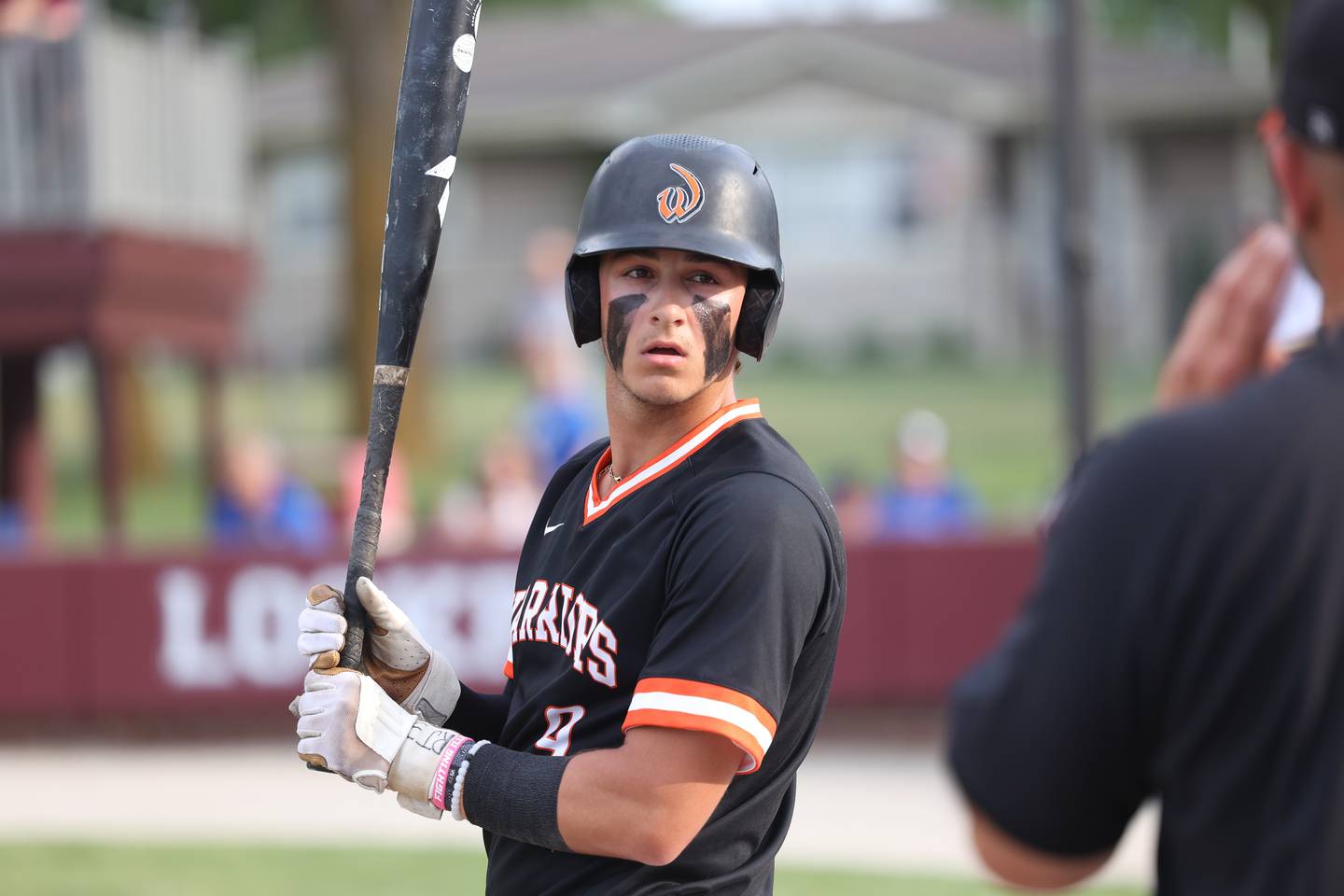 Lincoln-Way West’s Tyler Koscinski talks with a coach during a pitching change against Lincoln-Way East in the Class 4A Lockport Sectional semifinal on Thursday, June 1, 2023 in Lockport.