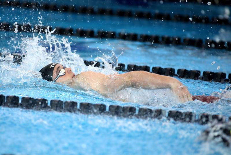 Hinsdale Central’s Joshua Bey competes in the 200-meter individual medley championship heat during the IHSA Boys State Championships on Saturday, March 1, 2025 at the FMC Natatorium in Westmont.