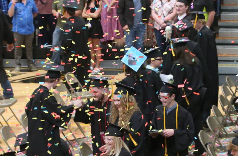 Putnam County High School Class of 2025 graduates pop confetti during the 59th annual Commencement on Sunday, May 18, 2025 in R.M. Germano gymnasium.