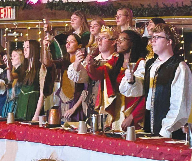 King and Queen Isaac Ebert and Alease McLain along with Prince Caleb Ward and Princess Sarah Eckardt make a toast during Oregon High School's Madrigal dinner on Saturday, Dec. 7, 2024. The event was held at the Brubaker Center at Stronghold Camp & Retreat Center north of Oregon. The troupe also performed on Friday. Dec. 6.