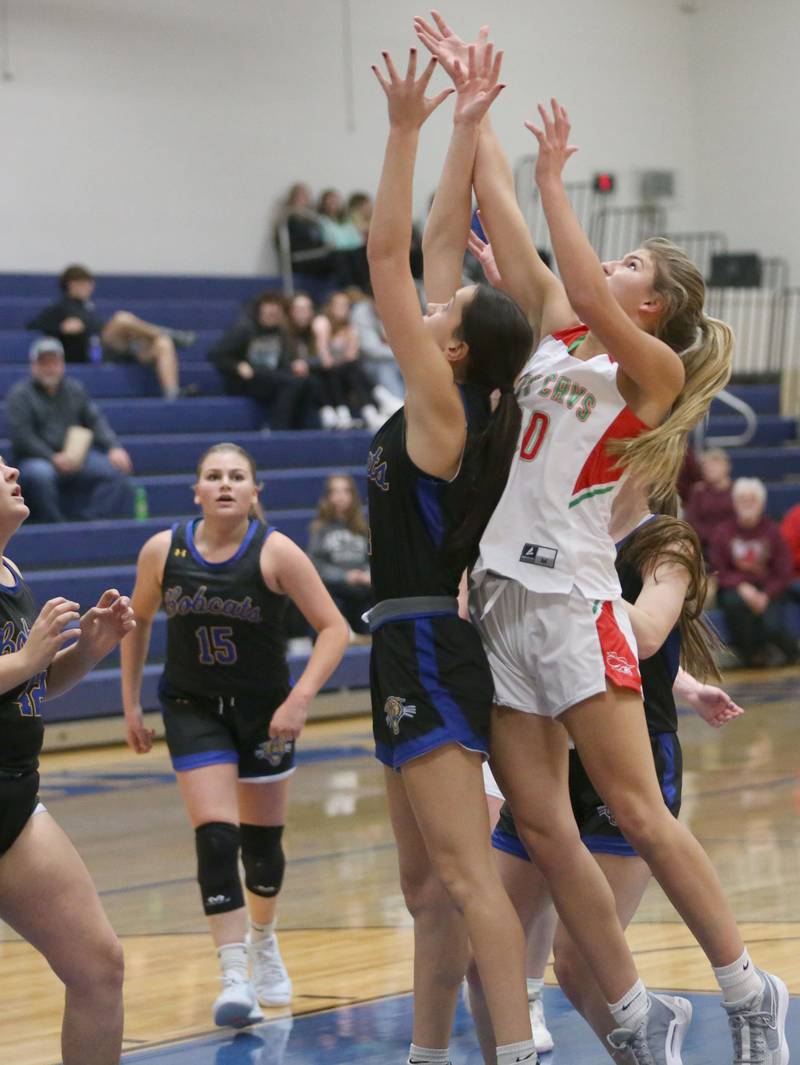 Somonauk's Emma Elder and L-P's Kelsey Frederick look to grab a rebound during the Tim Humes Breakout Tournament on Friday, Nov. 22, 2024 at Somonauk High school.