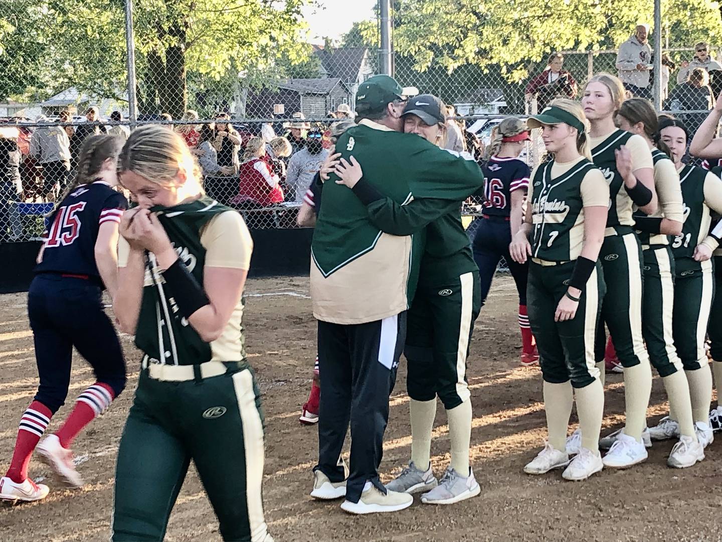St. Bede coach Shawn Sons lines up to hug his players after Friday's 2-1 loss in the sectional championship.