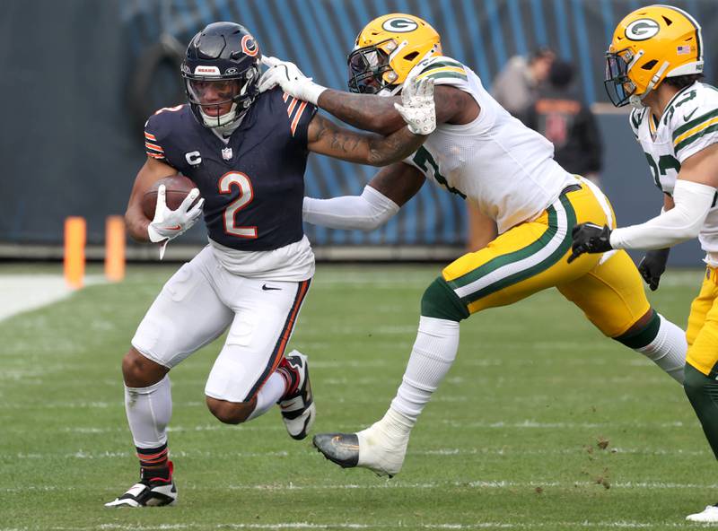 Chicago Bears wide receiver DJ Moore tries to pull away from Green Bay Packers linebacker Quay Walker Sunday, Nov. 17, 2024, during their game at Soldier Field in Chicago.