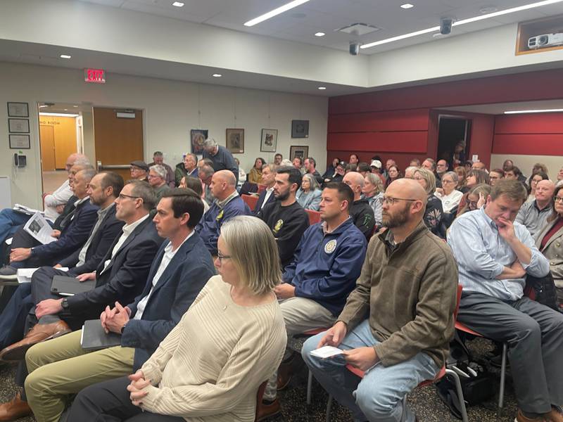 Dozens crowd into the audience for a packed DeKalb City Council meeting on Dec. 8, 2025, at the DeKalb Public Library. After a nearly 2.5-hour public hearing, the City Council unanimously approved the data center in a series of votes.