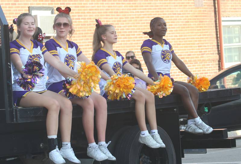 Mendota High School cheerleaders ride down Indiana Avenue during the homecoming parade on Friday, Oct. 3, 2025