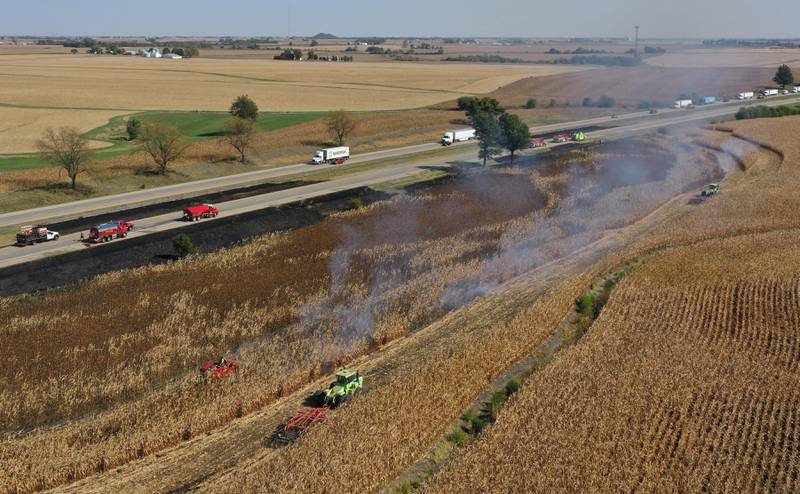 Firefighters extinguish a brushfire on Wednesday, Oct. 9, 2024 along Interstate 80 in the eastbound lane near mile post 65 in Bureau County. A MABAS box alarm was sent out around 11:45 a.m. and upgraded to a fourth-alarm. Interstate 80 was shut down in the Eastbound lane while firefighters doused the flames. Fire companies from Utica, Oglesby, Ladd, Bureau, Hennepin, Peru, La Salle, Spring Valley and others responded to the scene.