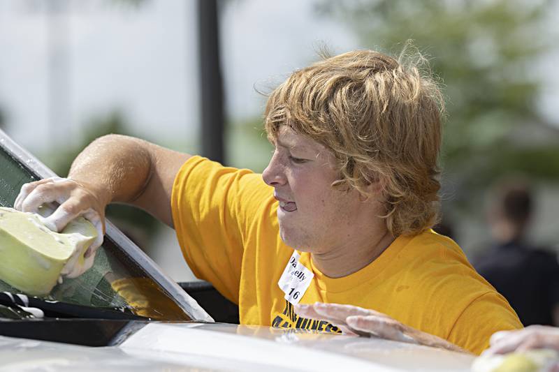 Daniel Kelly of Newman works the BLIND car wash Friday, August 4, 2023 in Sterling.