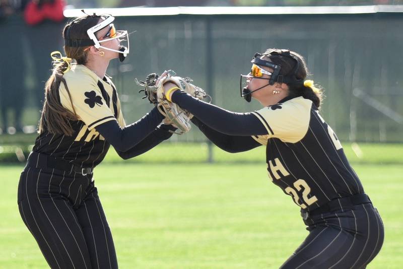 Bishop McNamara's Sophia Piggush, left, and Gabby Burnett celebrate a Fightin' Irish double play during a home game against Bradley-Bourbonnais Thursday, May 7, 2026.