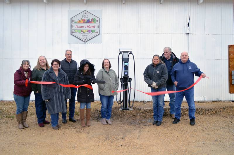 Polo's first electric vehicle charging station opened for service on Friday, Dec. 1. It's located at 212 S. Division Ave./Illinois Route 26. Left to right are Polo Deputy City Clerk Sue Waszak; former Alderwoman Beth Sundman; First State Bank customer service lead Kris Peterson; Polo Chamber of Commerce Board of Directors member Troy Rahn; City Clerk Sydney Bartelt; First State Bank Polo Branch Manager Pam White; Tammy Merdian; Alderman and Ogle County Economic Development Corporation President Randy Schoon; and Mayor Doug Knapp.