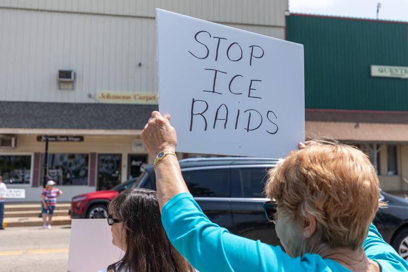 Protester holds sign at the “No Kings” protest on Saturday, June 14, 2025 at Rotary Park in Princeton.