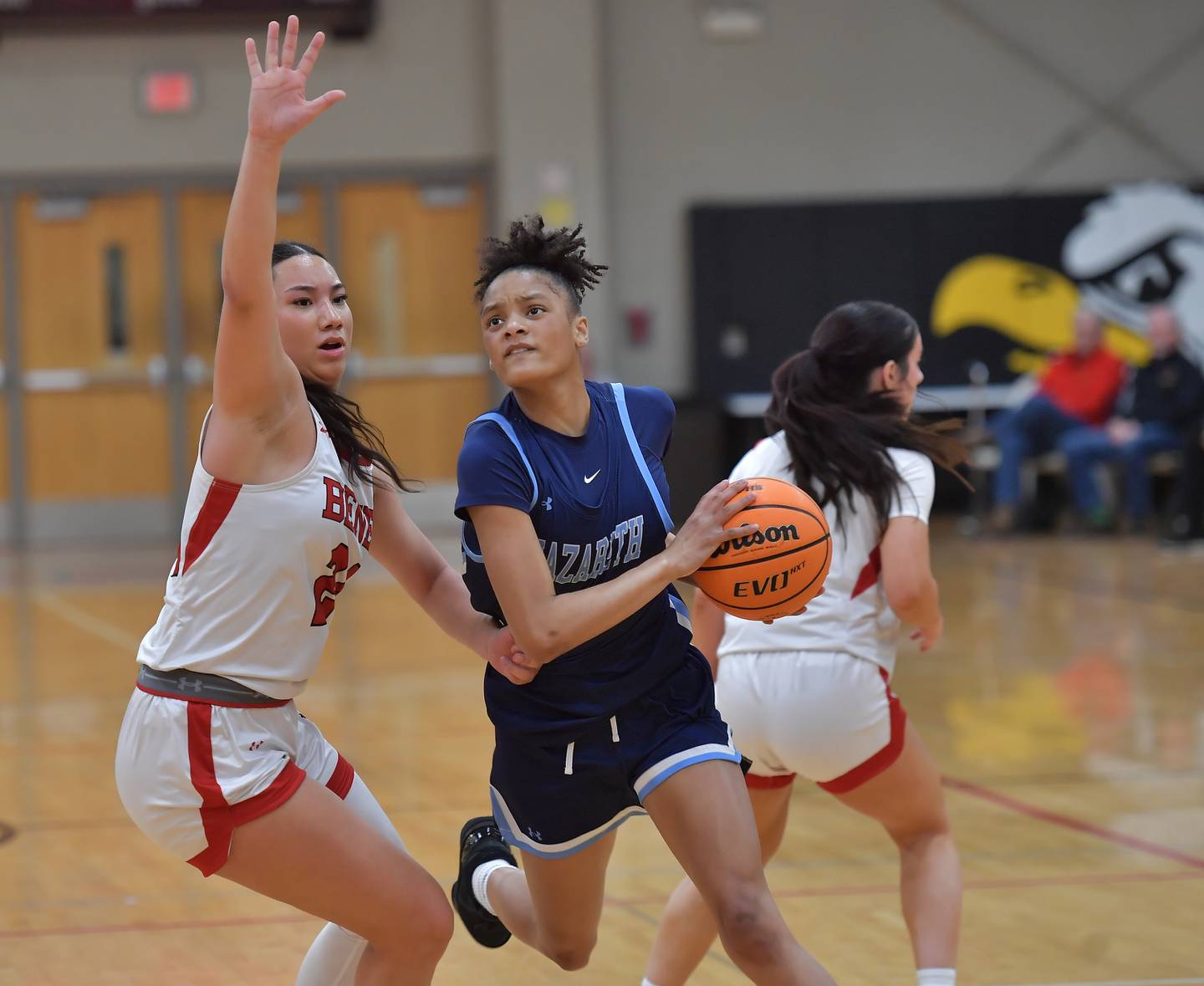 Nazareth’s Nazareth’s Mia Gage drives to the basket as Benet’s Emma Briggs defends during a game on January 28, 2026 at Benet Academy in Lisle.