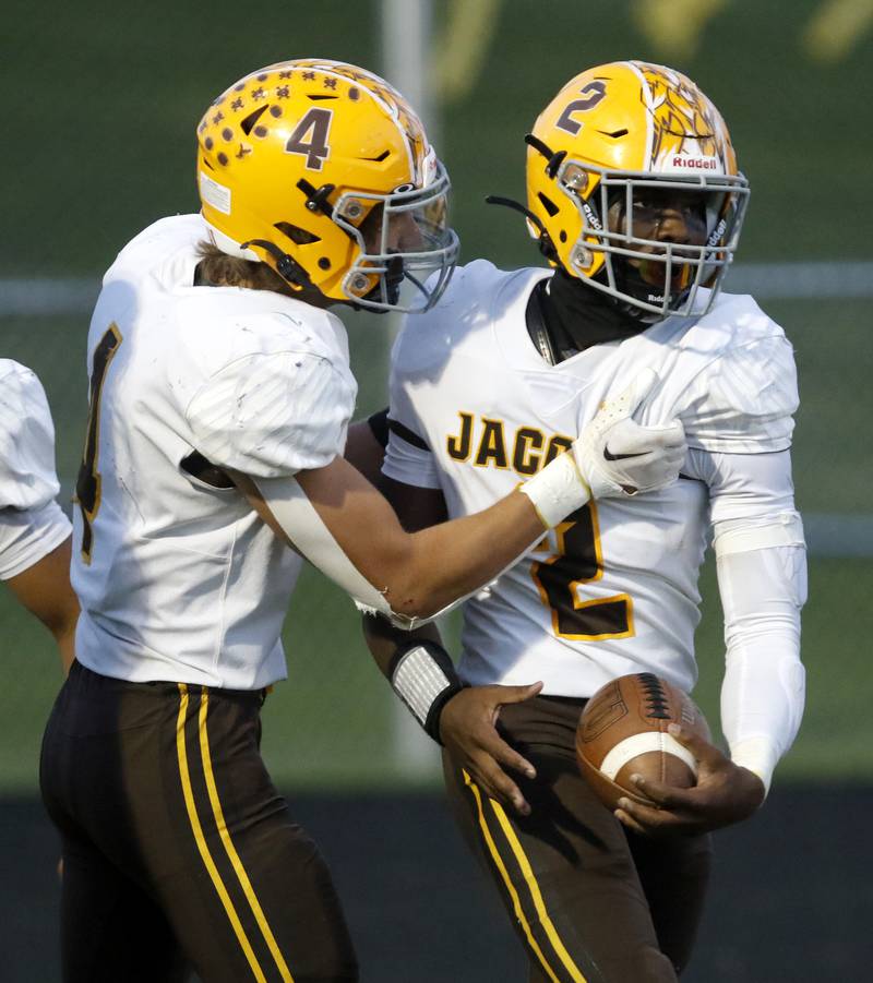 Jacobs' Joey Scrivani celebrates with his teammate, Antonio Brown, after Brown scored a touchdown, during a Fox Valley Conference football game between Jacobs and Prairie Ridge Friday, Sept. 16, 2022, at Jacobs High School in Algonquin.