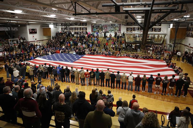 Lockport honored over 140 military veterans individual before the start of the game against Lincoln-Way East on Friday, Dec. 1, 2023 in Lockport.