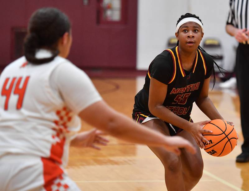 Montini’s Paige Pittman takes aim at the basket as Minooka’s Jaelle Hamilton (44) defends during a Montini Christmas Tournament game on December 22, 2025 at Montini Catholic High School in Lombard.