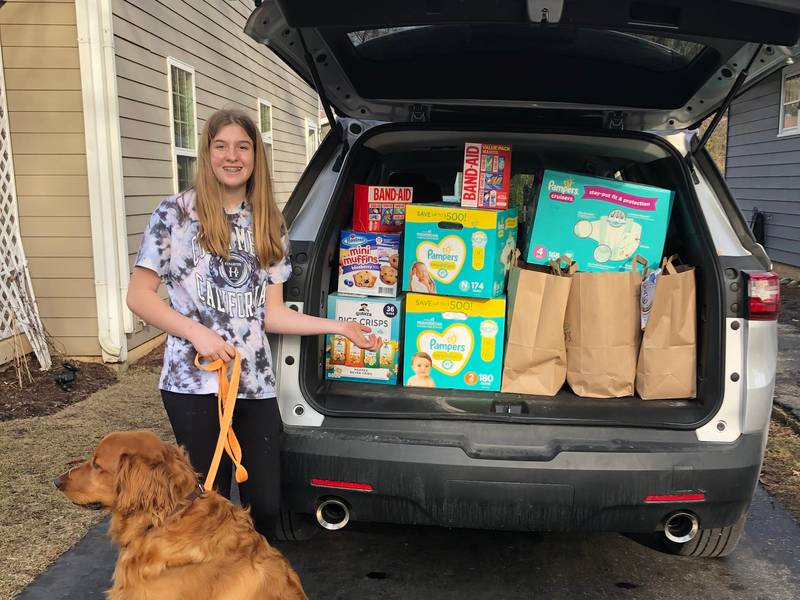 Erin Johnson, an eighth grader at Richard Bernotas Middle School in Crystal Lake, helped collect thousands of hygiene items, shown here, as part of a districtwide donation drive to aid families in Ukraine during the current war with Russia.