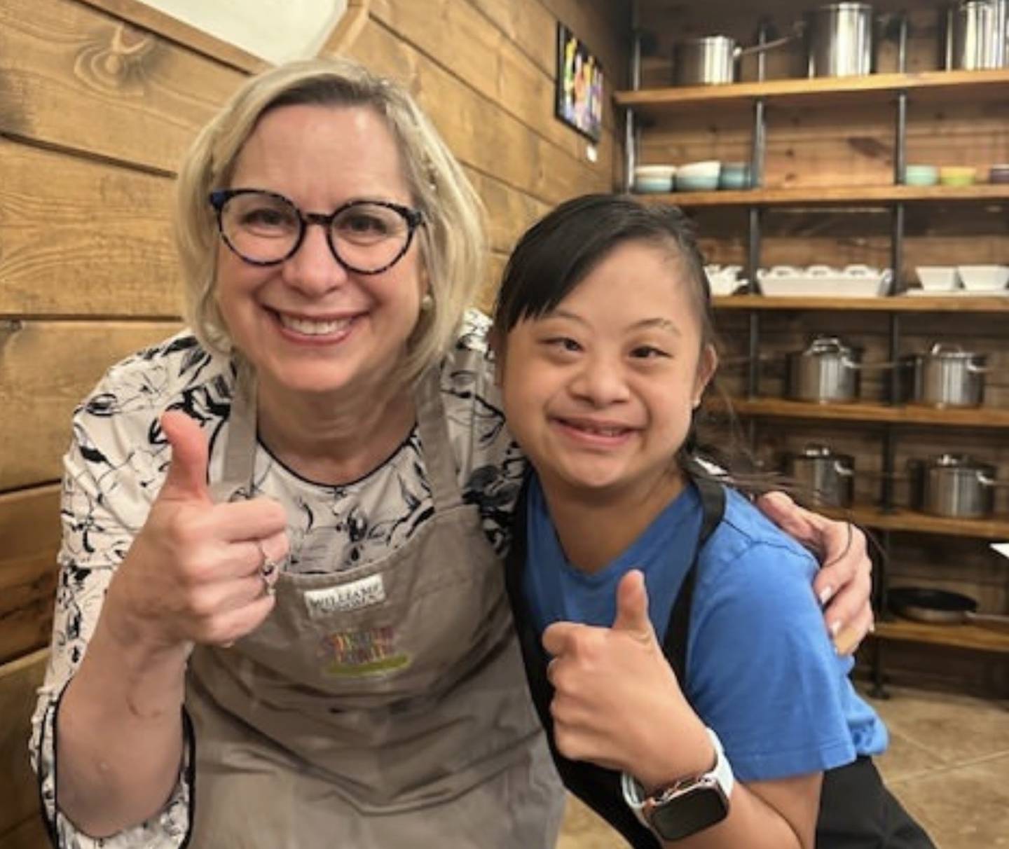 Teacher Mary Zupke with Maxine DelMundo of Batavia after a successful cooking lesson through the Rising Lights Project.  Zupke teaches two cooking classes per month for Rising Lights and has her own noprofit The Garden Plate LLC.