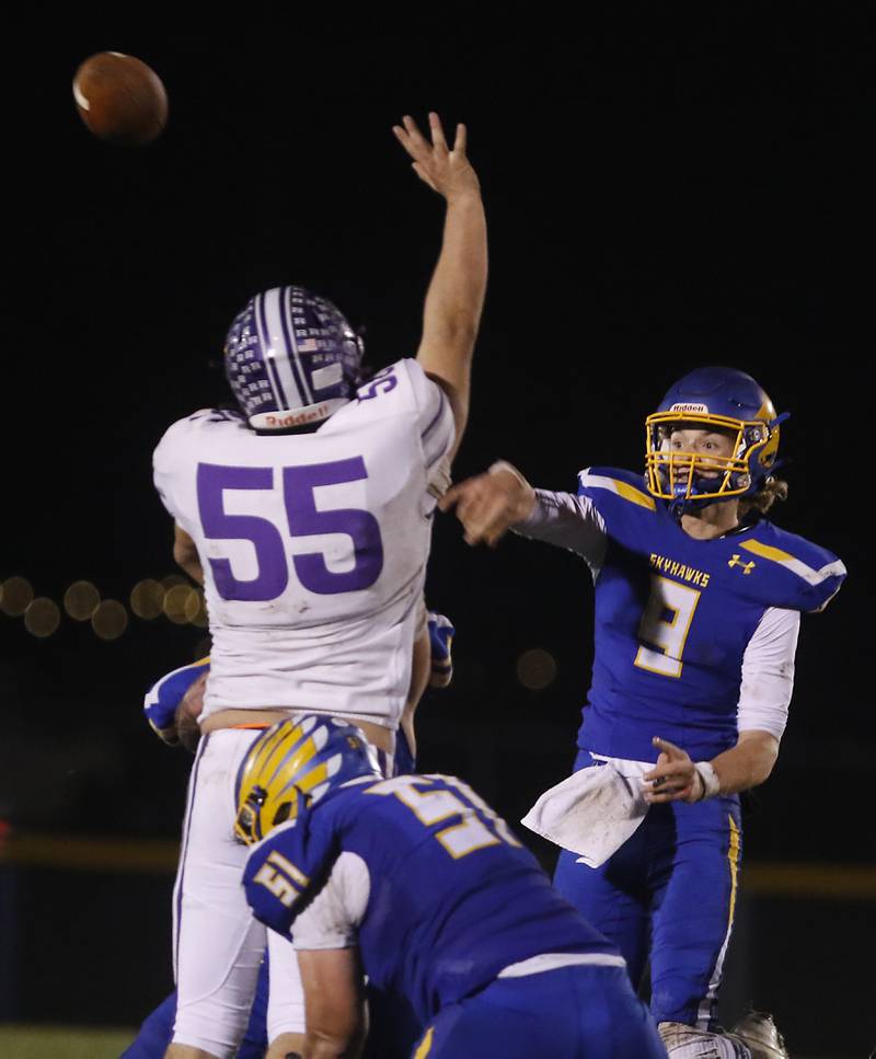 Johnsburg's Anthony Bravieri pass the ball as he is rushed by Rochelle's Kaiden Morris during a IHSA Class 4A second round playoff football game Friday, Nov. 4, 2022, between Johnsburg and Rochelle at Johnsburg High School in Johnsburg.