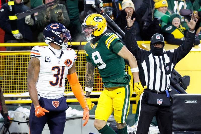 Green Bay Packers wide receiver Christian Watson (9) catches a touchdown pass against Chicago Bears safety Kevin Byard III (31) during an NFL game, Sunday, Dec. 6, 2025, in Green Bay, Wis. (AP Photo/Jeffrey Phelps)
