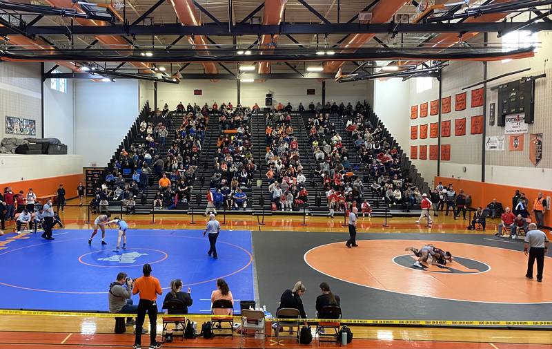 Both mats run in front of a packed house at the Class 3A Normal Community Individual Sectional on Saturday, Feb. 11, 2023.