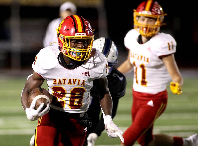 Batavia's AJ Sanders carries the ball during a game at St. Charles North on Friday, Oct. 22, 2021.