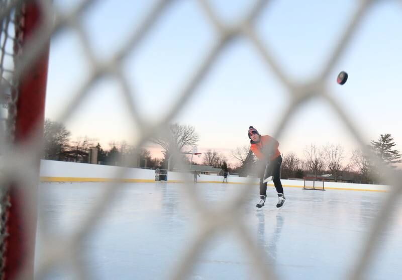 Stuart McGunnigal of Peru, fires a slap shot into the net on Thursday, Dec. 5, 2024 at Washington Park in Peru.