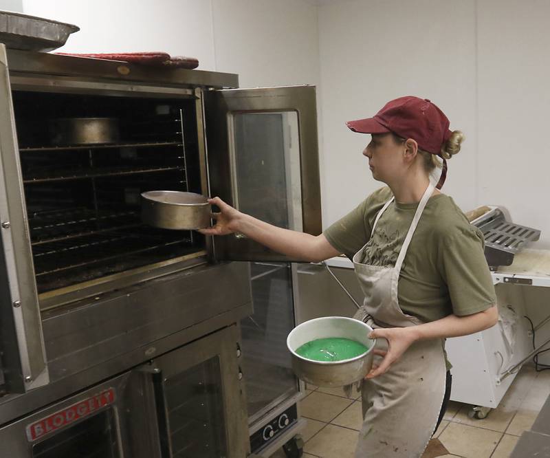 Corinna Bendel-Sac, the owner of Uprising Bakery and Cafe, 2104 Algonquin Road, in Lake in the Hills, makes a rainbow cake Thursday, July 14, 2022, at the bakery. UpRising, after announcing a drag show for Saturday, July 23, has faced an incredible amount of harassment and opposition.