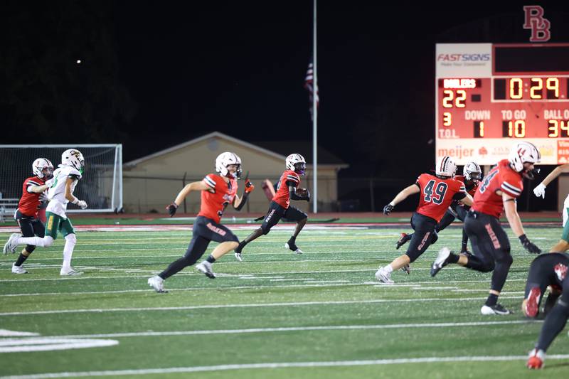 Bradley-Bourbonnais' LyZale Edmon, center, runs an interception back up the field during the Boilermakers' 35-6 victory over Waubonsie Valley Friday, Sept. 12, 2025.