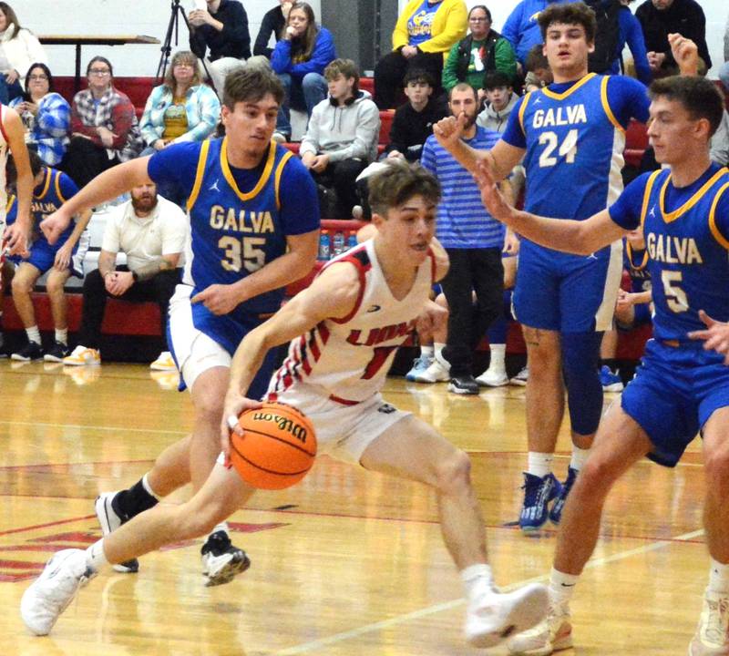 LaMoille's Ed Fry drives on Galva in the second half during Thursday's game at Dean Madsen Gymnasium in LaMoille. The Wildcats won 68-40.