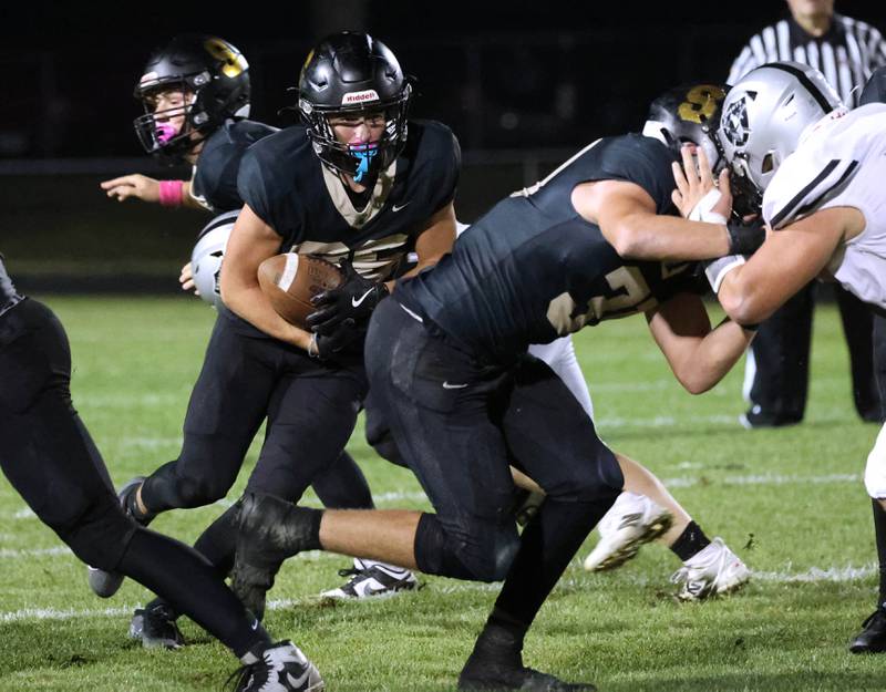 Sycamore's Liam Arhos follows his blockers during their game against Kaneland Friday, Oct. 3, 2025, at Sycamore High School.