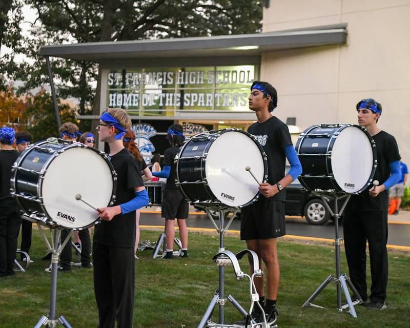 St. Francis’s drum line preforms outside of the stadium before the start of the game on Friday Oct. 3, 2025, held at St. Francis High School.