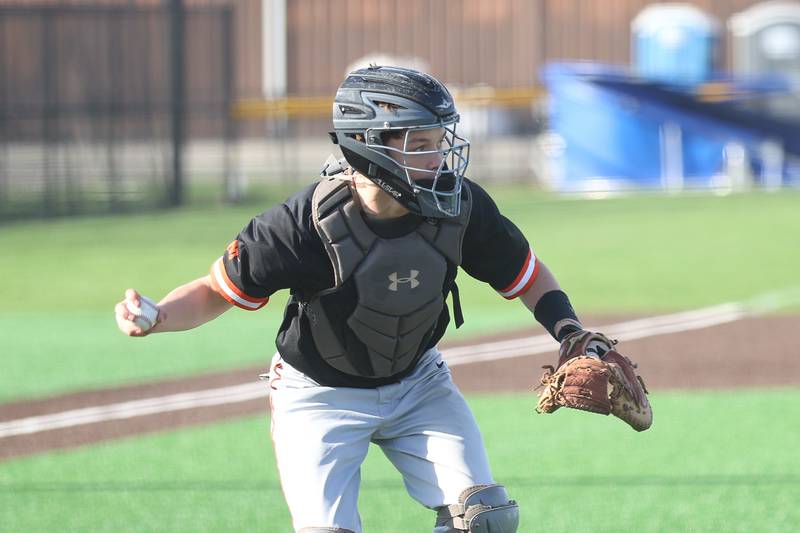 Minooka’s Mason Vogt looks to throw to first against Joliet Central on Monday, April 6, 2026 in Joliet.