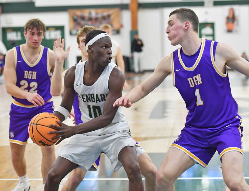Glenbard West’s Josh Abushanab (10) looks to pass as Downers Grove North’s Colin Doyle (1) defends during a game on January 23, 2026 at Glenbard West High School in Glen Ellyn.