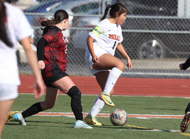 DeKalb's Carla Murrieta pushes the ball ahead of Rockford East's Karina Garcia during their game Tuesday, March 25, 2025, in the Barb Fest tournament at DeKalb High School.