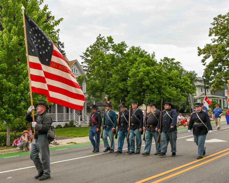The 10th Illinois infantry reenactors march in the Independence Day parade on Friday July 4, 2025, in downtown Downers Grove.