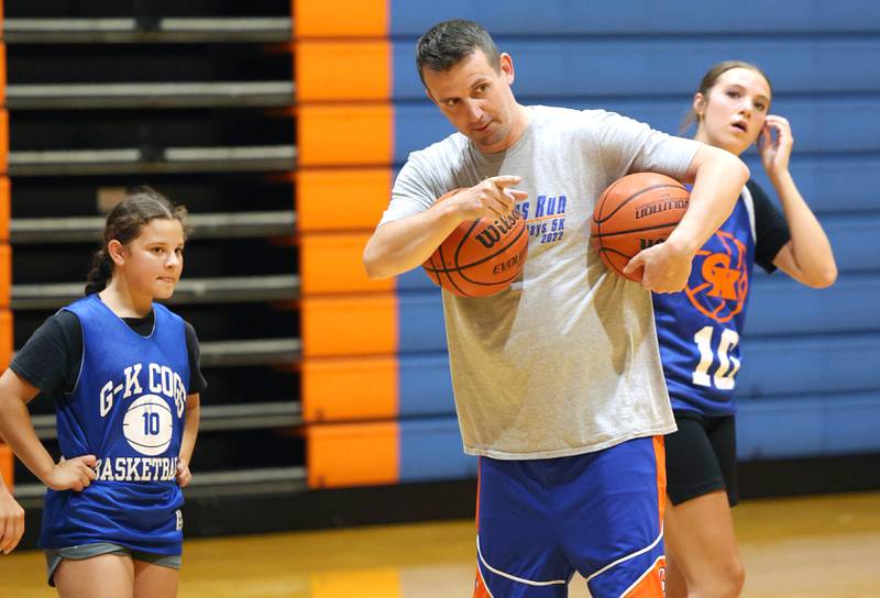 New Genoa-Kingston girls basketball coach Doug Brewington gives his team some instruction Wednesday, June 26, 2024, during summer practice at the school. Brewington was the head girls basketball coach at Hinckley-Big Rock last year.