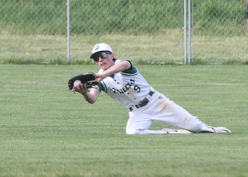 St. Bede's Ryan Slingsby squeezes his glove but fails to hold the ball in during a running catch attempt against Marquette on Monday, April 22, 2024 at St. Bede Academy.