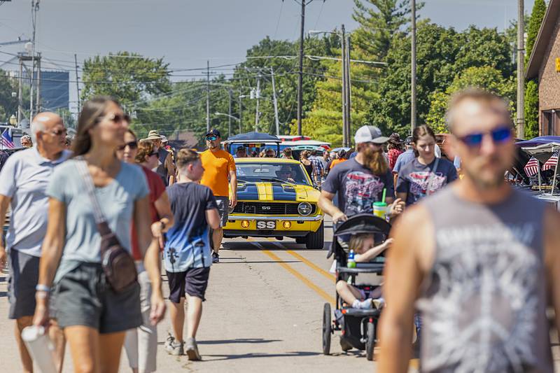 Visitors stroll the downtown Sunday, Aug. 25, 2024, during Amboy’s Depot Days car show. Thousands of people capped off the four-day festival with the car show and drawing on Sunday.