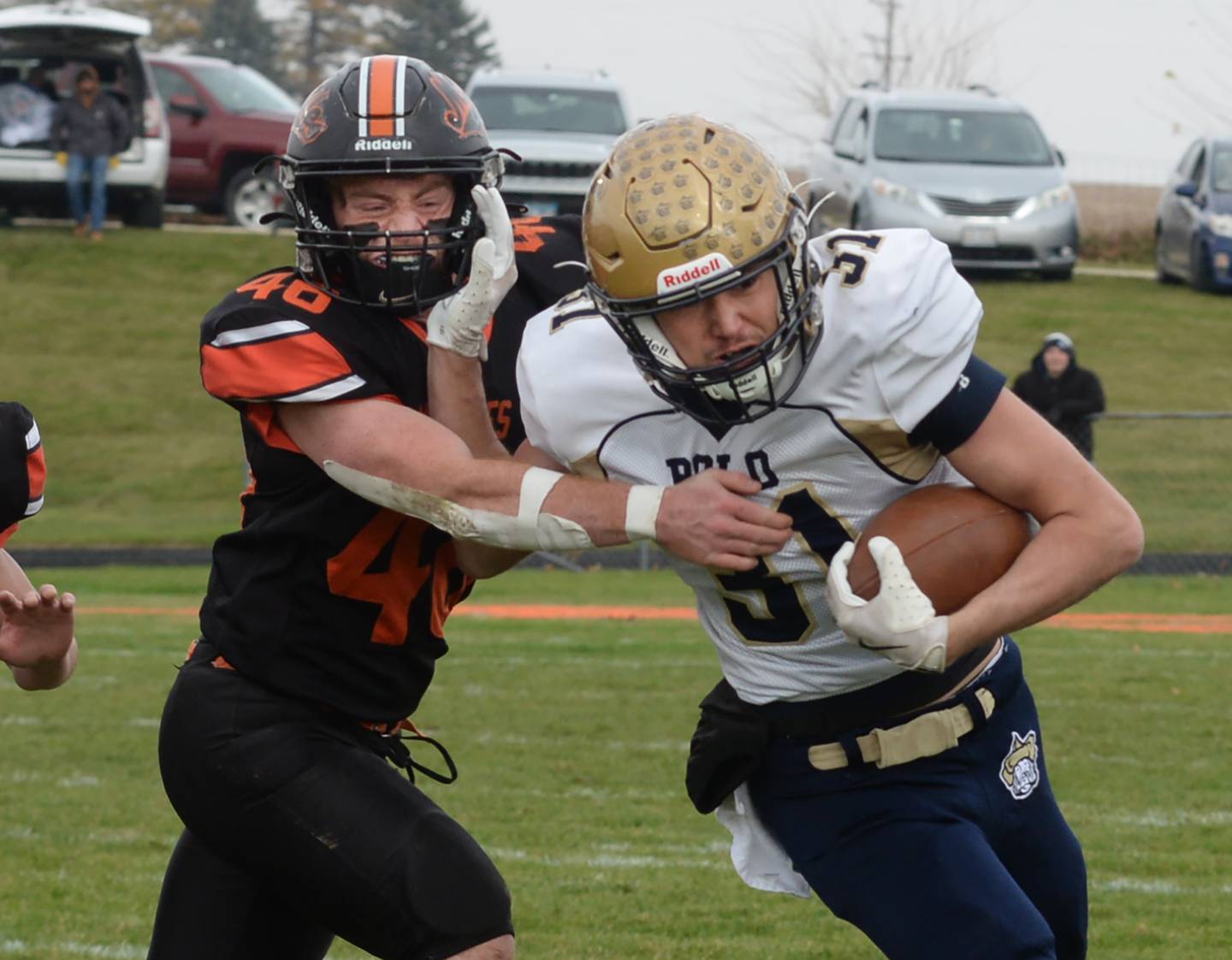 Polo's Noah Dewey (31) fights off Milledgeville's Spencer Nye (46) during 8-man playoff action against Milledgeville on Saturday, Nov. 16, 2024 at Milledgeville.
